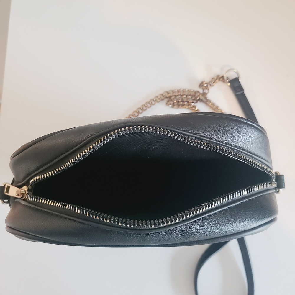 Sleek Black Leather Crossbody Bag with Metallic Accents